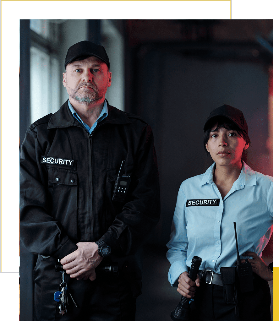 Two security guards standing in uniform.
